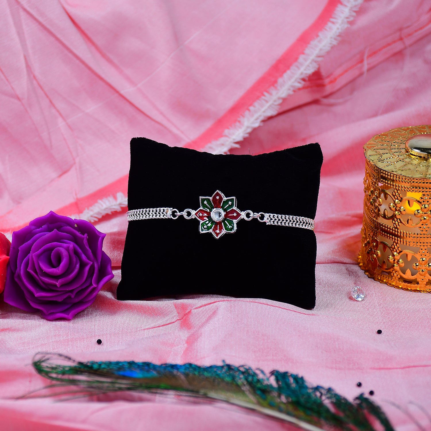 Star Floral Rakhi With Red-green Enamel And Silver Chain Star Floral Rakhi With Red-green Enamel And Silver Chain